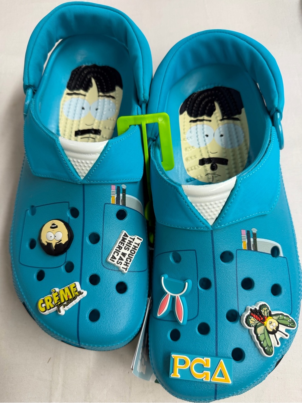 CROCS Kids Teal Graphic Clog Shoes with Character Charms